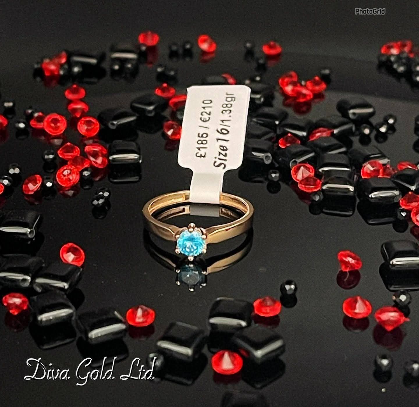 Gold women ring. Blue zircon stone. Size 16