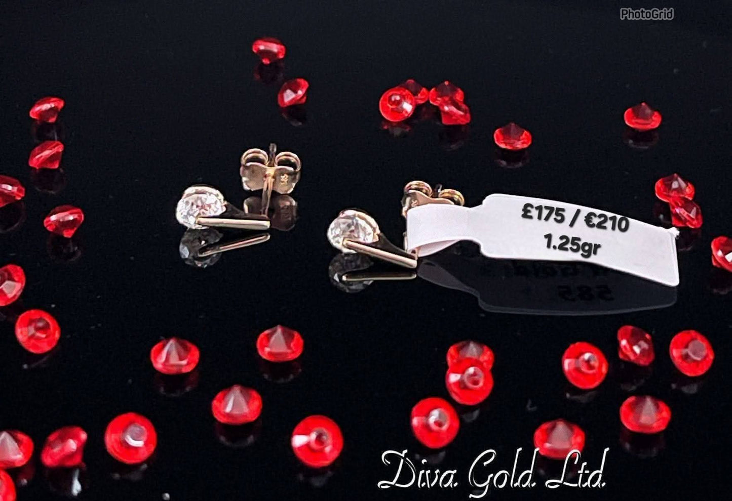 Stud gold earrings / white zircon stones.