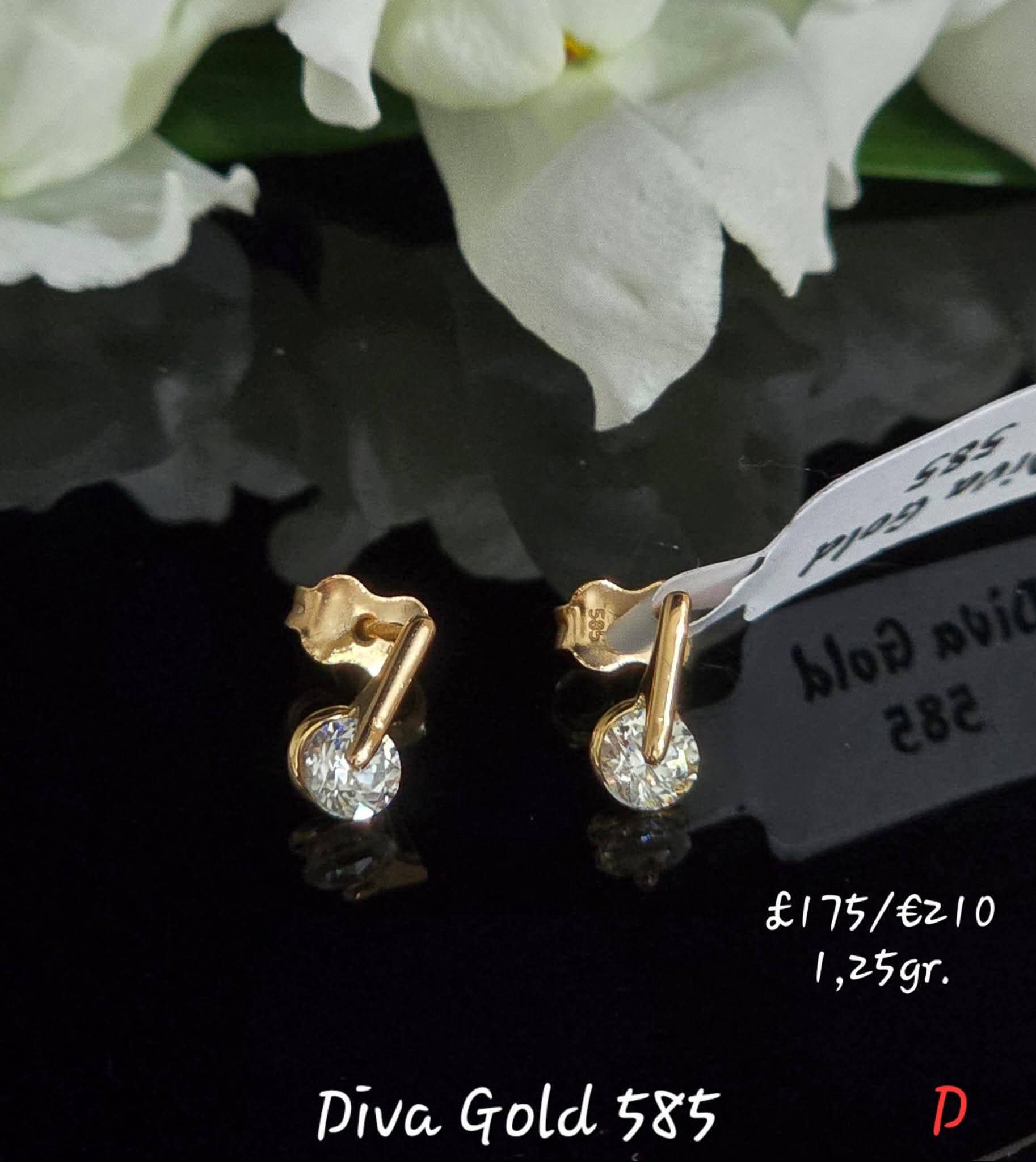 Stud gold earrings / white zircon stones.