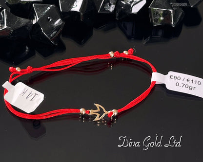 Red thread bracelet with 585 gold details. 0.70gram