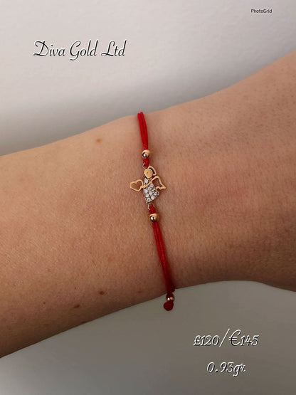 Red thread bracelet with 585 gold details. 0.93gram