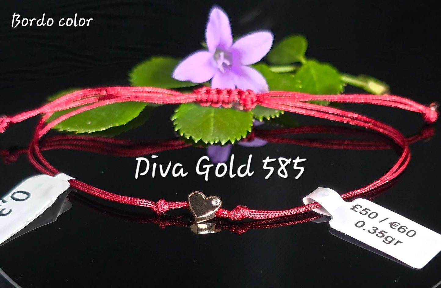 Burgundy thread bracelet with 585 gold details. 0.35gram