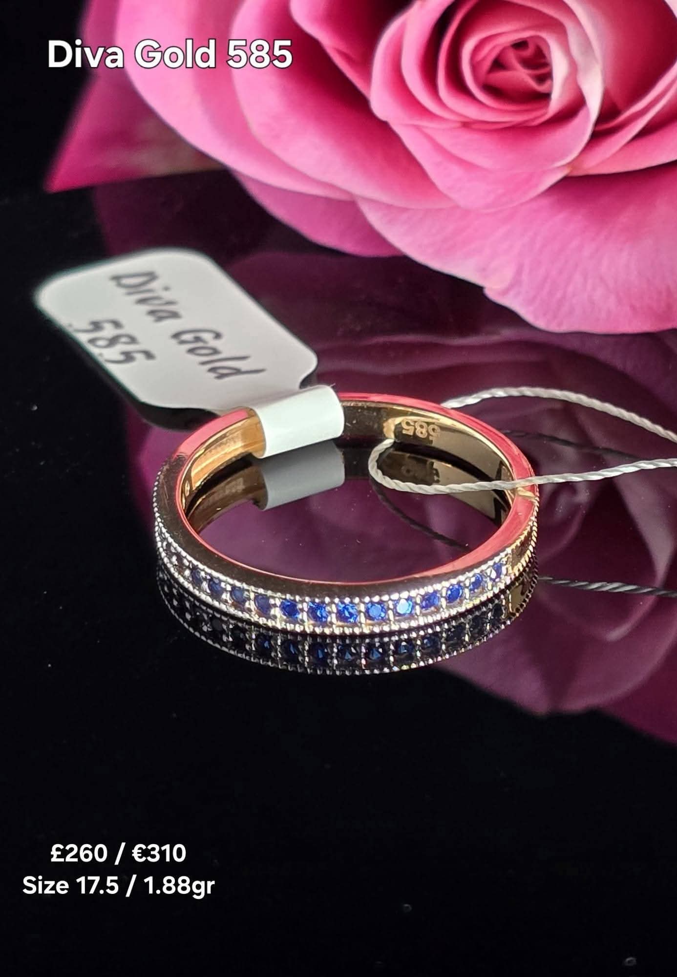 Gold women ring with blue zircon stones. Size 17.5