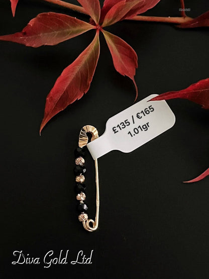 gold brooch with onyx. 1.01 gram