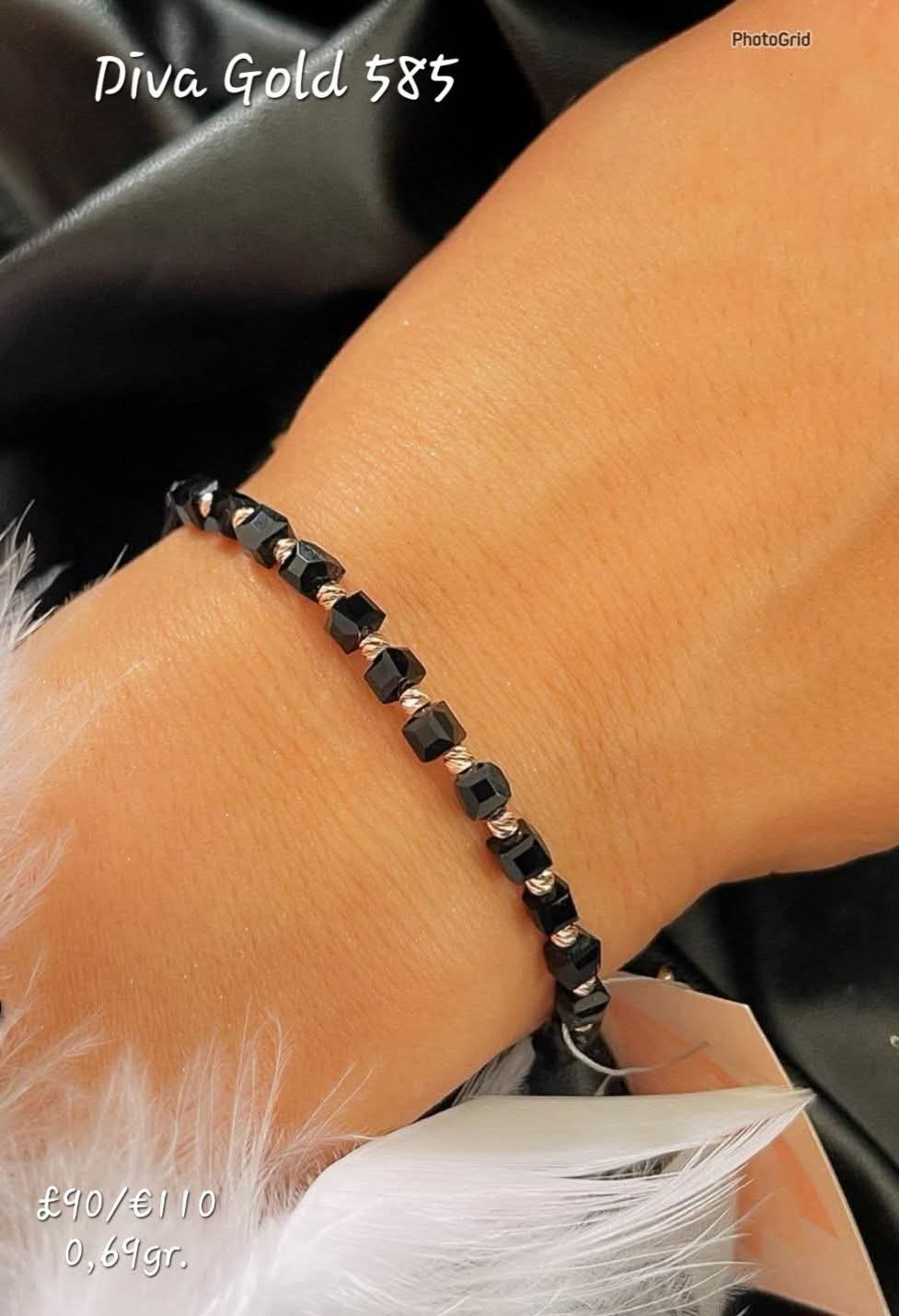 Black thread bracelet with 585 gold details. 0.69gram