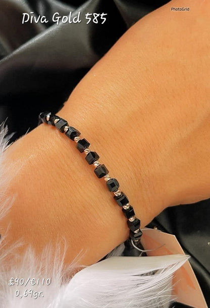 Black thread bracelet with 585 gold details. 0.69gram
