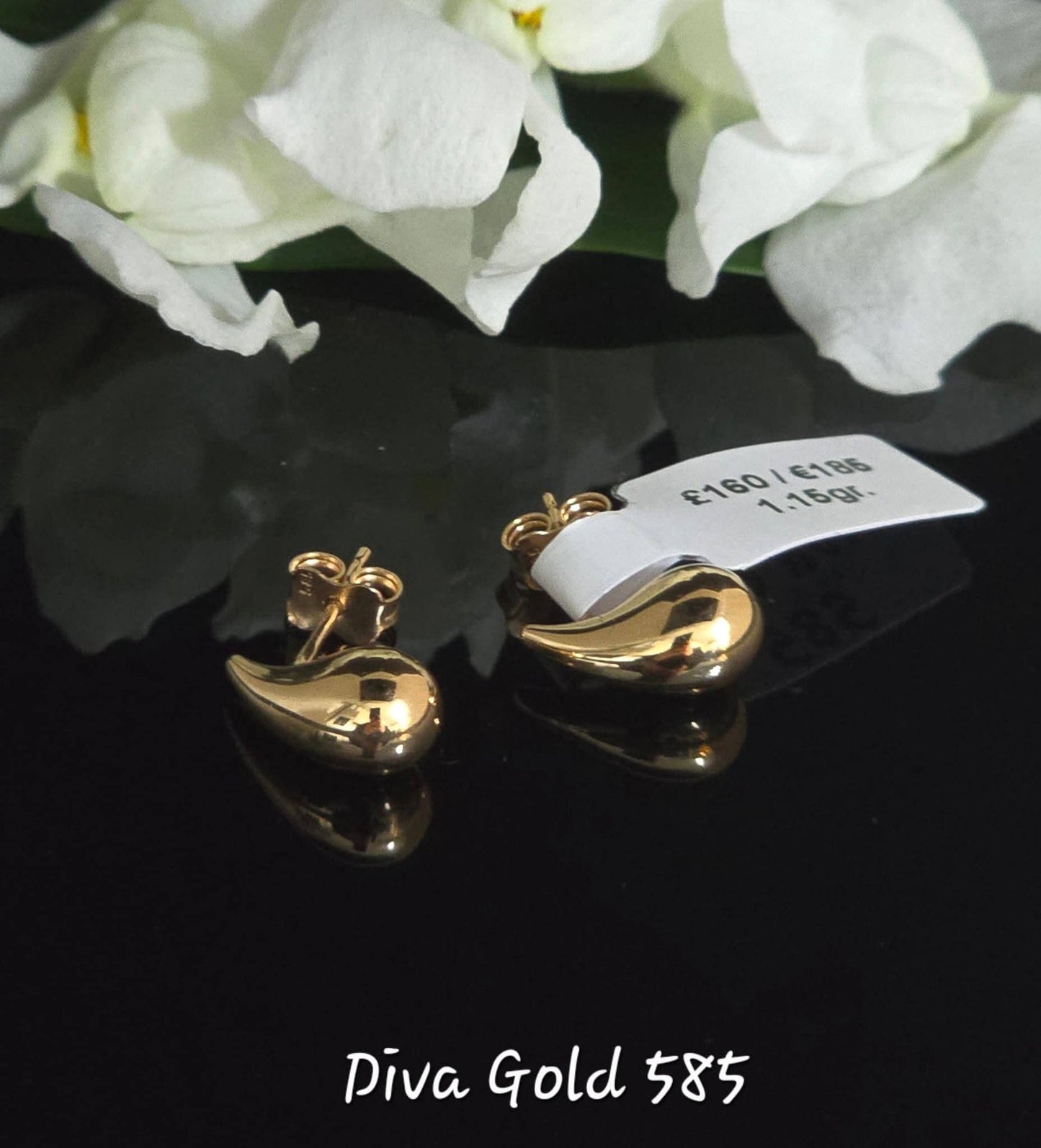 Stud drop gold earrings.