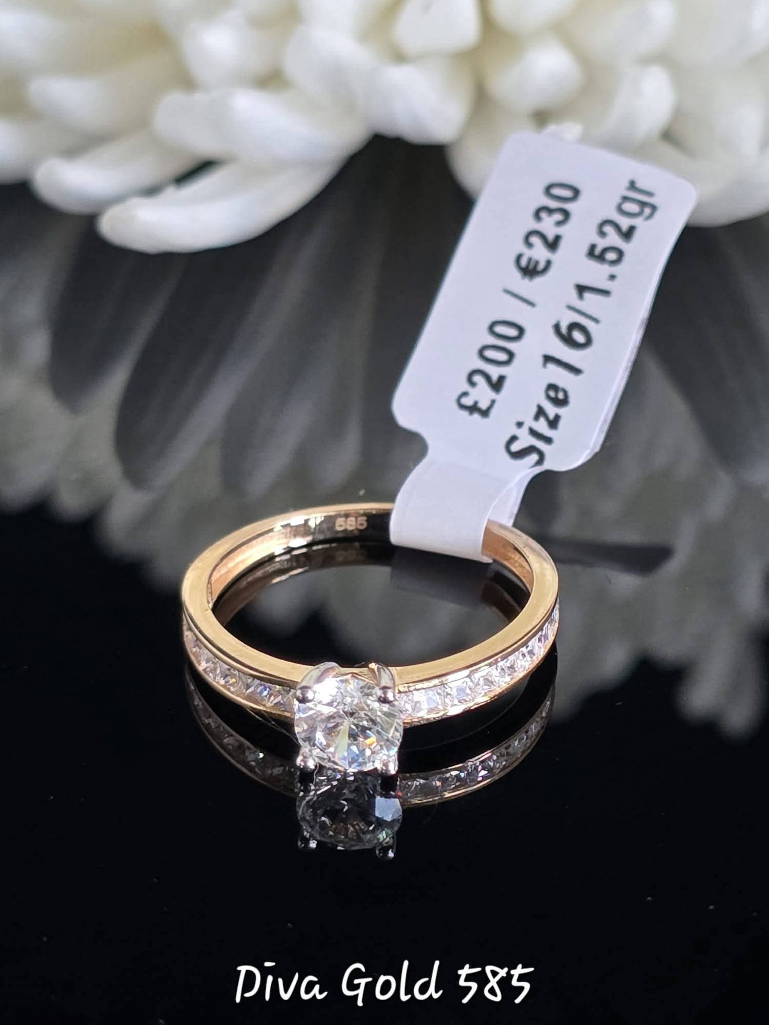Gold women ring. White zircon stones.Size 16