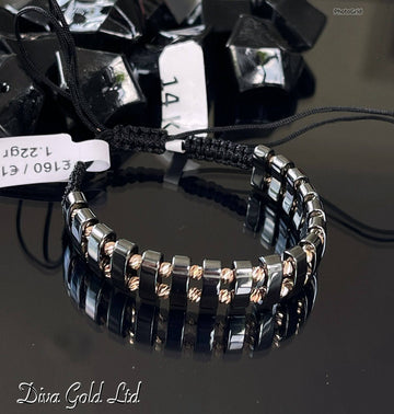 Black thread bracelet with 585 gold details. 1.22gram