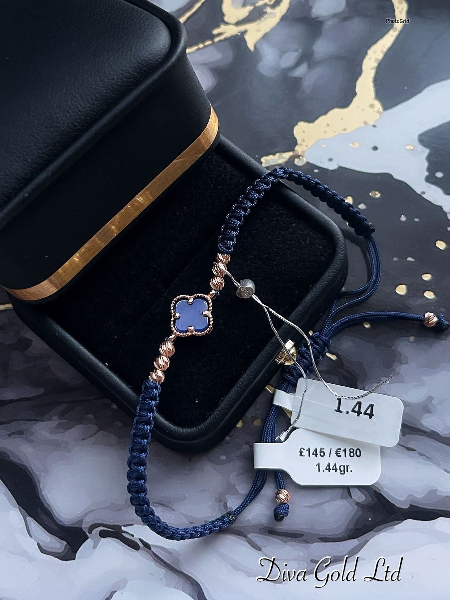 Clover blue thread bracelet with gold details.