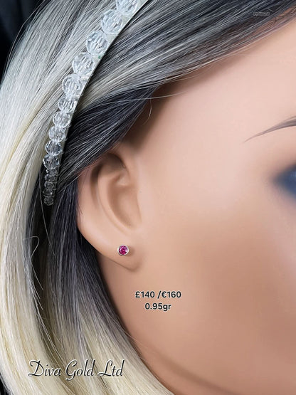 Stud gold earrings. Pink zircon stones