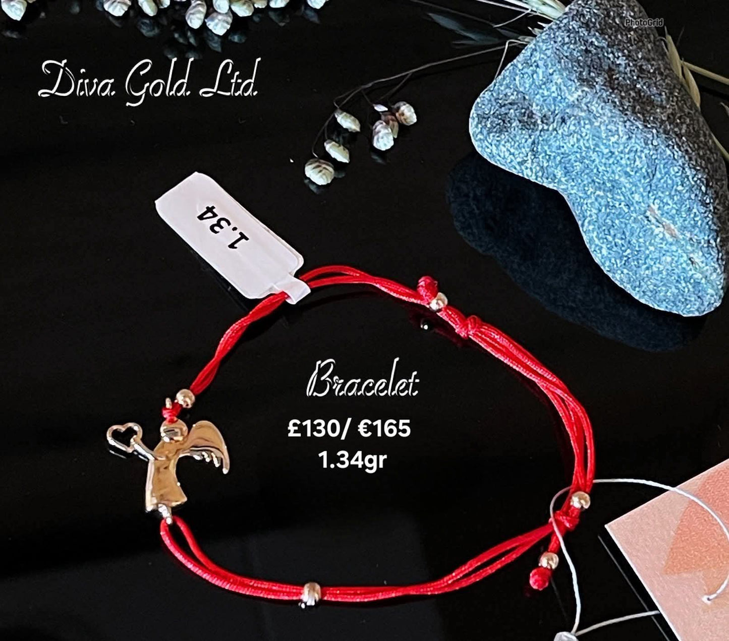 Red thread bracelet with gold details.