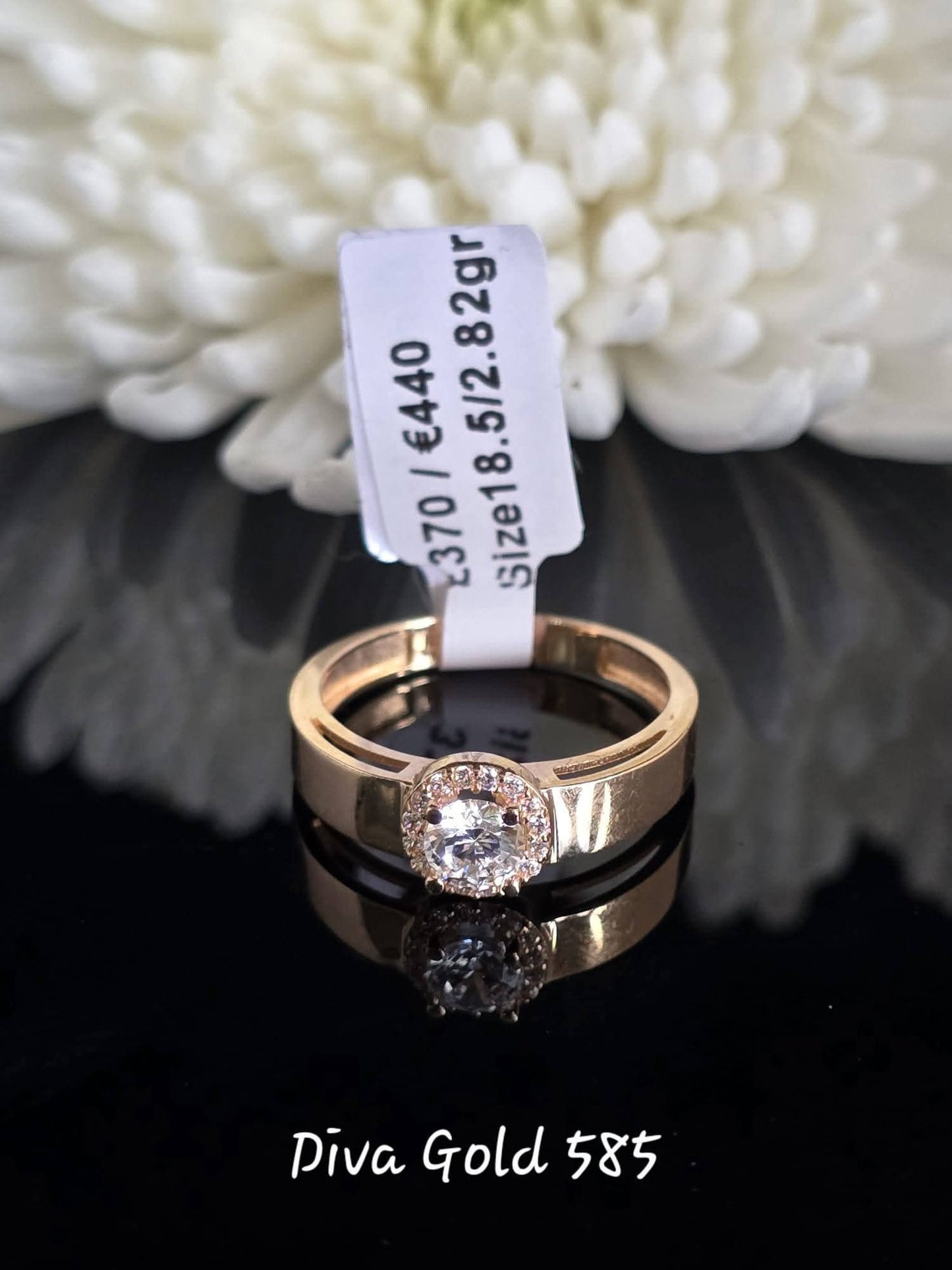 Gold women ring with white zircon stones. Size 18.5