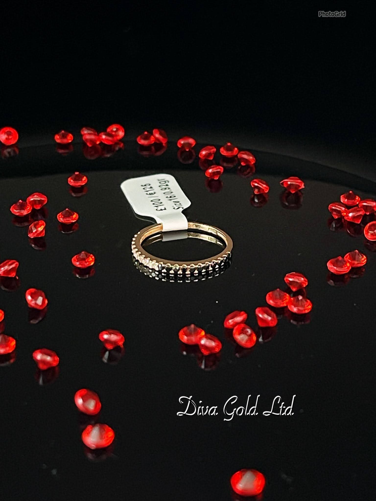 Gold ring with white & black zircon stones. Size 16