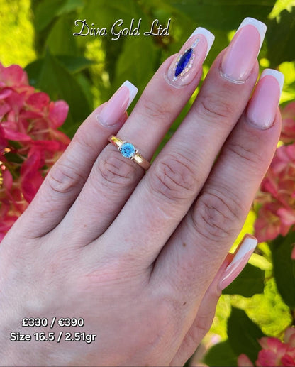 Gold women ring / blue zircon stone. Size 16.5