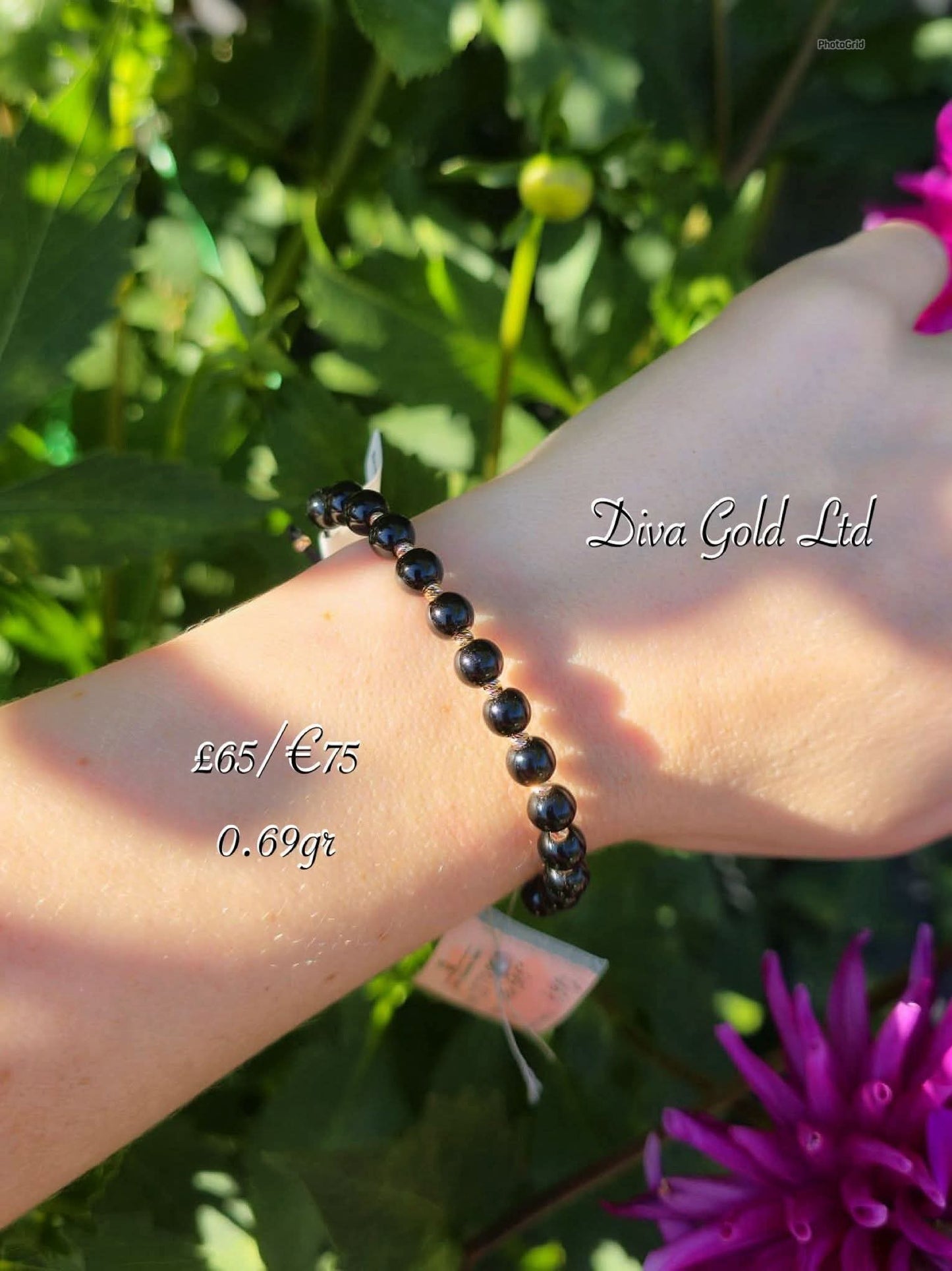 Black thread bracelet with gold details.