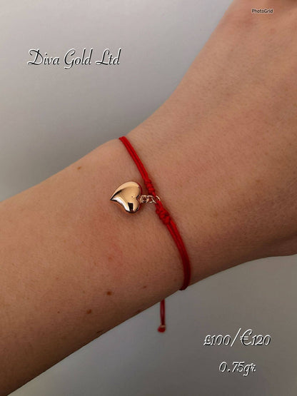 Red thread bracelet with 585 gold details. 0.75gram