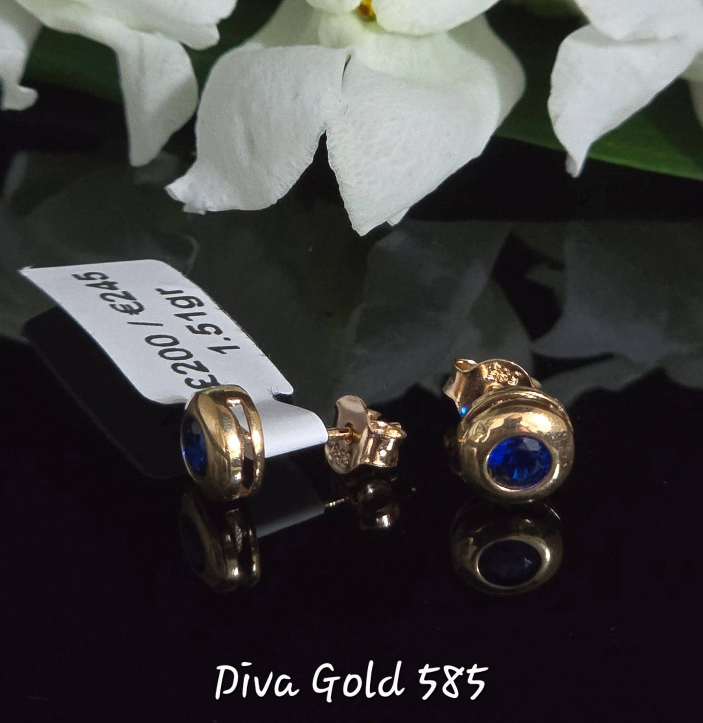 Stud gold earrings. Blue zircon stones