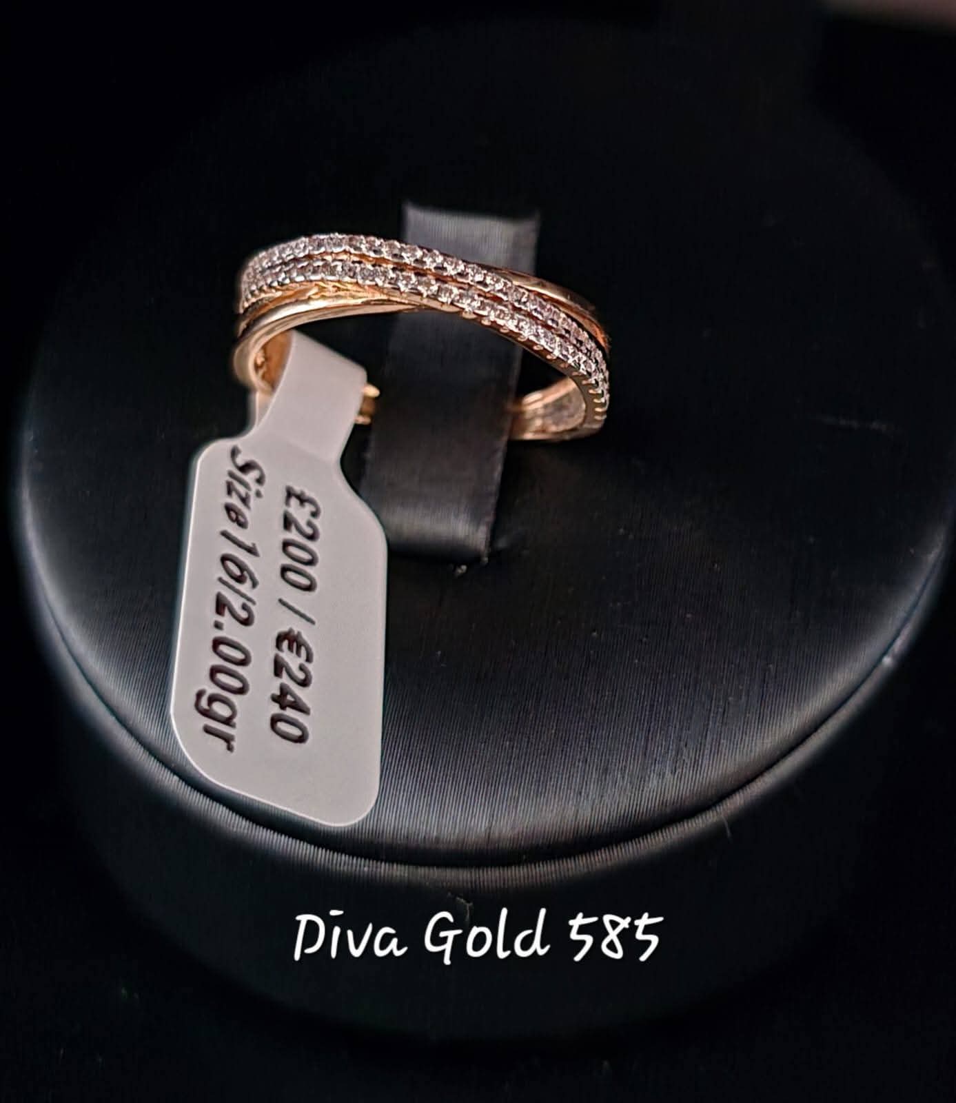 Gold ring with white zircon stones. Size 16