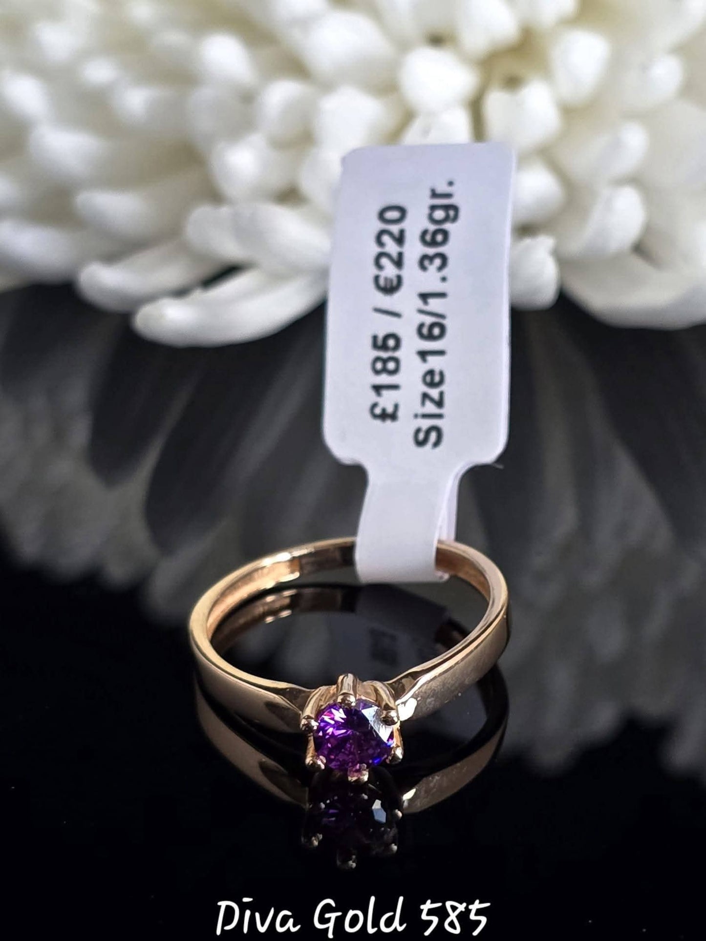 Gold women ring. Purple zircon stone.Size 16
