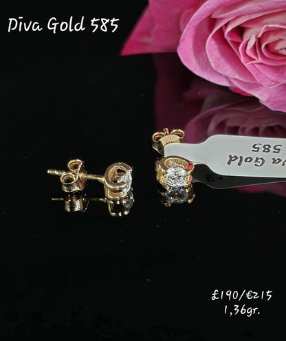 Stud gold earrings. White zircon stones