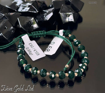 Dark green thread bracelet with 585 gold details. 0.68gram