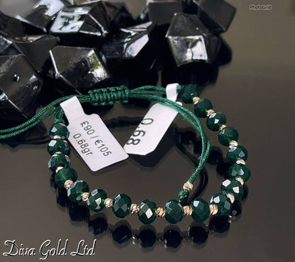 Dark green thread bracelet with 585 gold details. 0.68gram