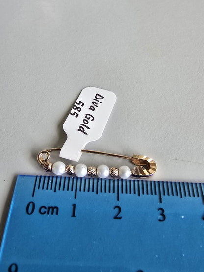 gold brooch with pearl. 1.07gr
