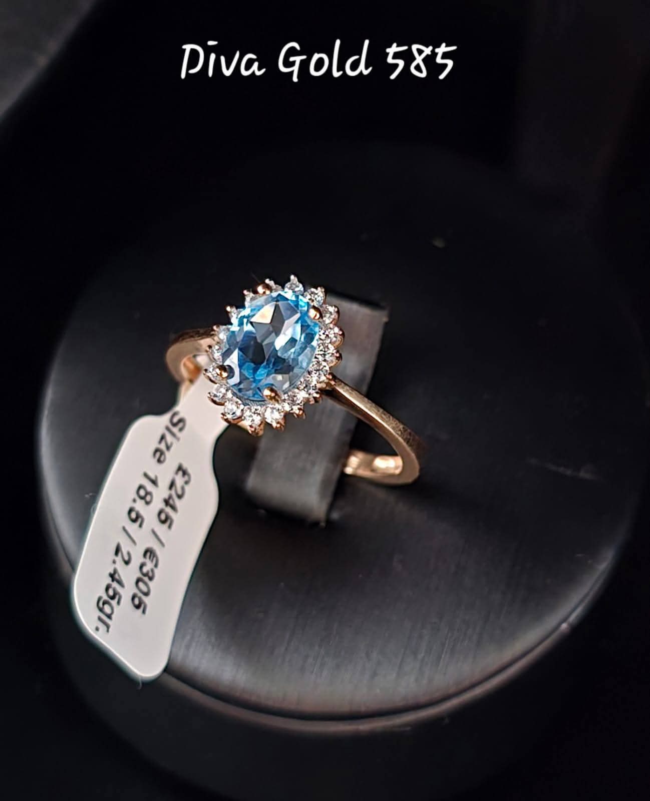 Gold ring with blue&white zircon stones. Size 18.5