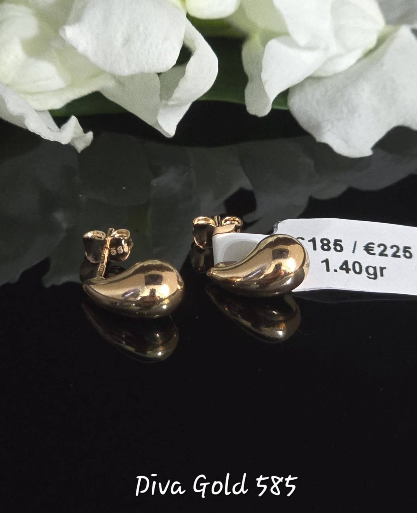 Stud drop gold earrings.