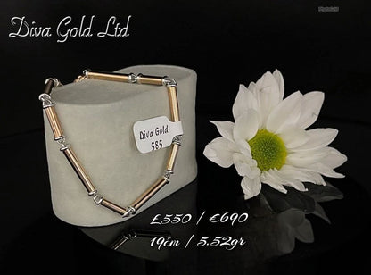 Gold bracelet with white gold details.  19cm