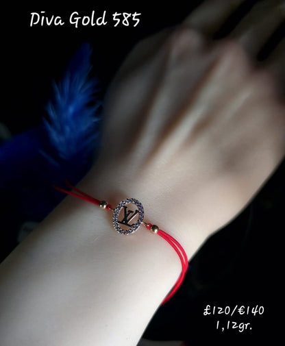 Red LV thread bracelet with gold details.