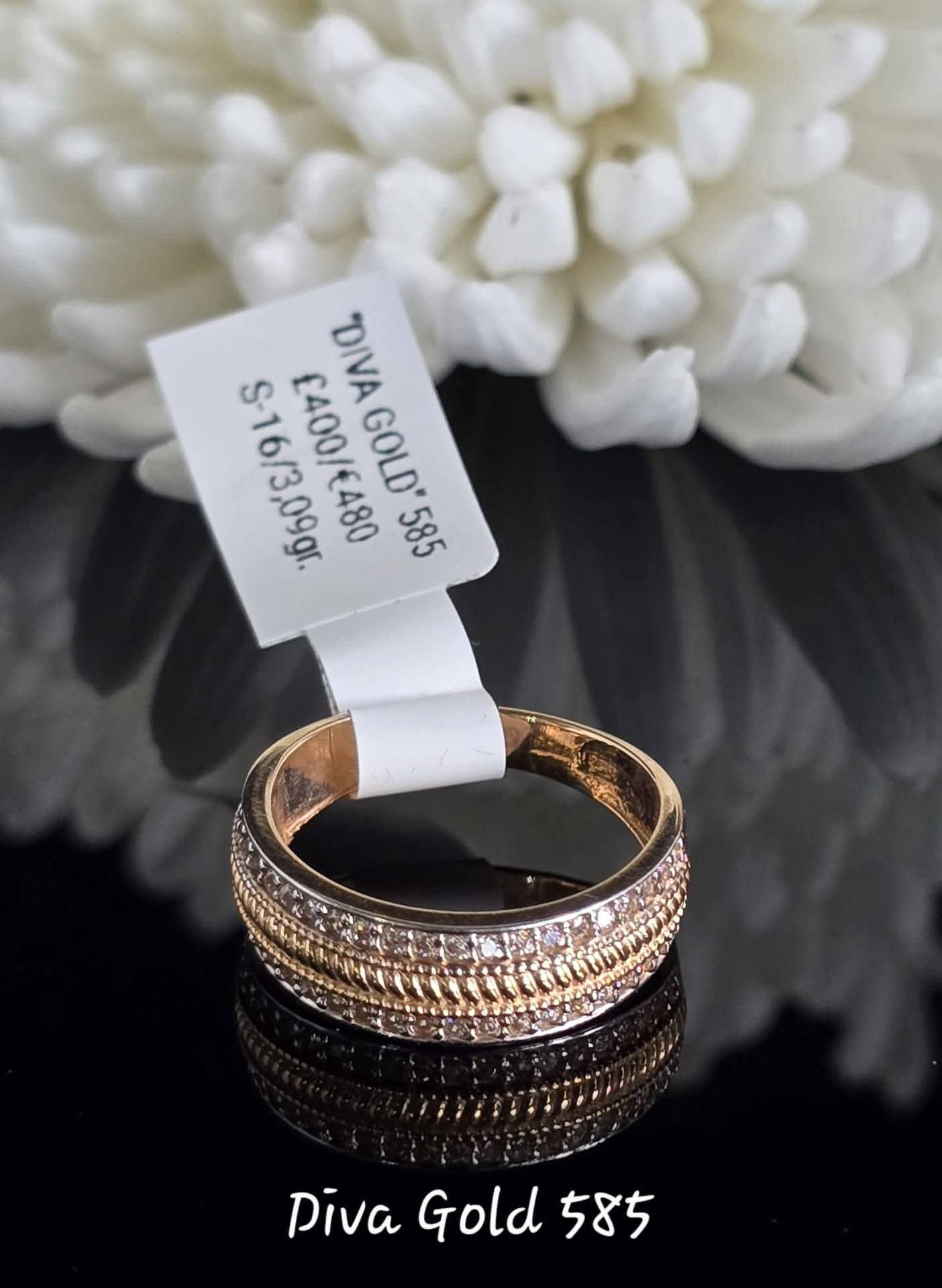 Gold women ring. White zircon stones.Size 16