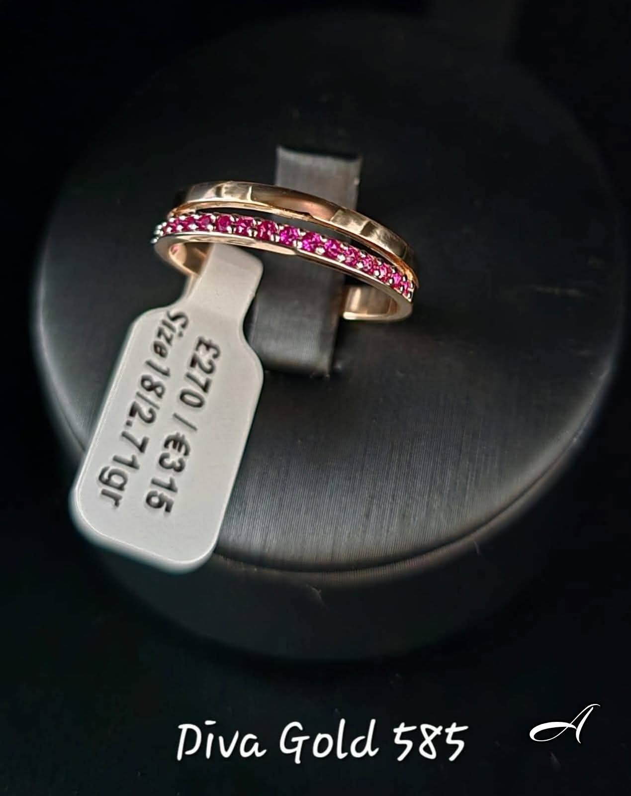 Gold ring with pink zircon stones. Size 18