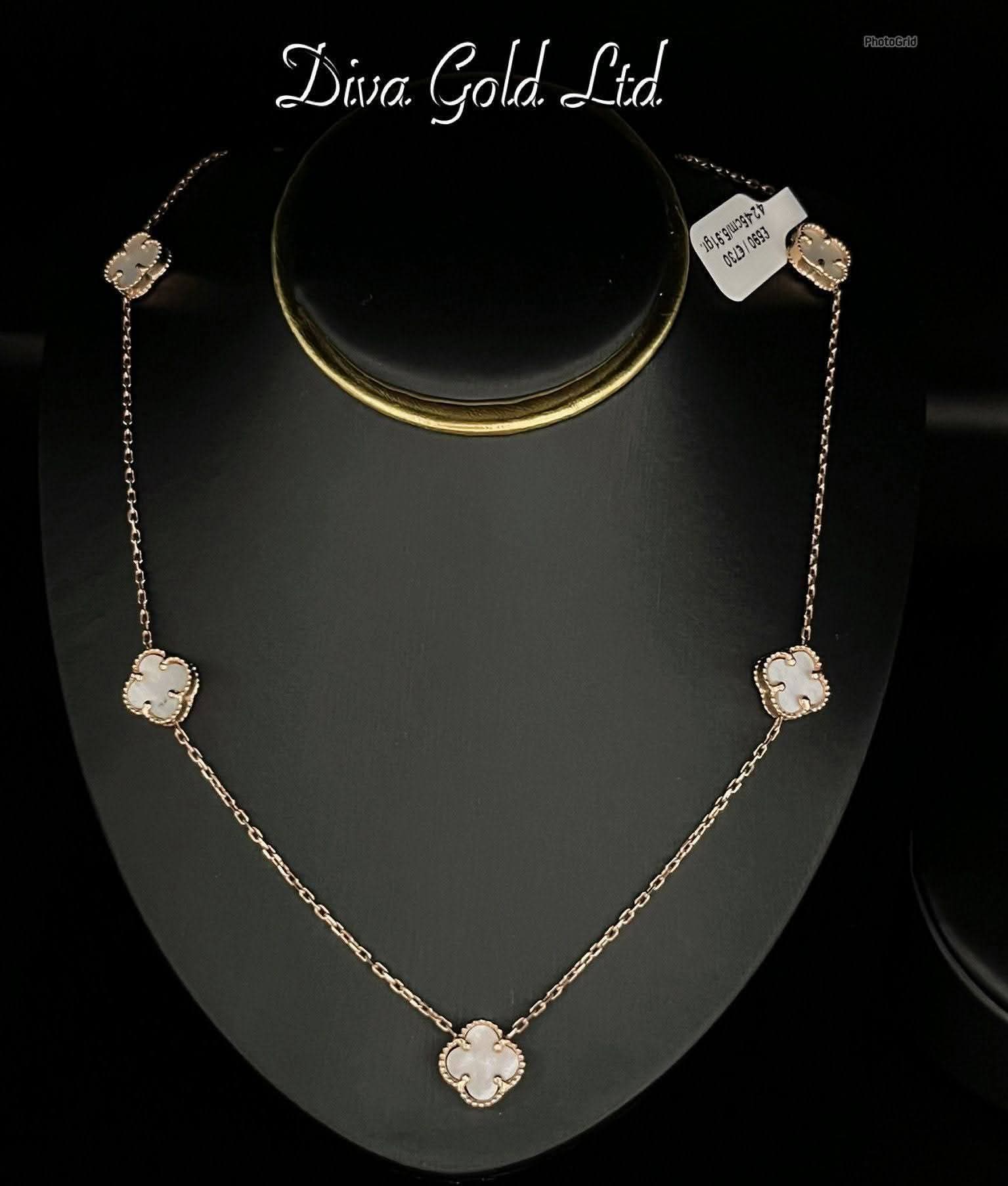 Gold chain with white clover pendants. 42-45 cm
