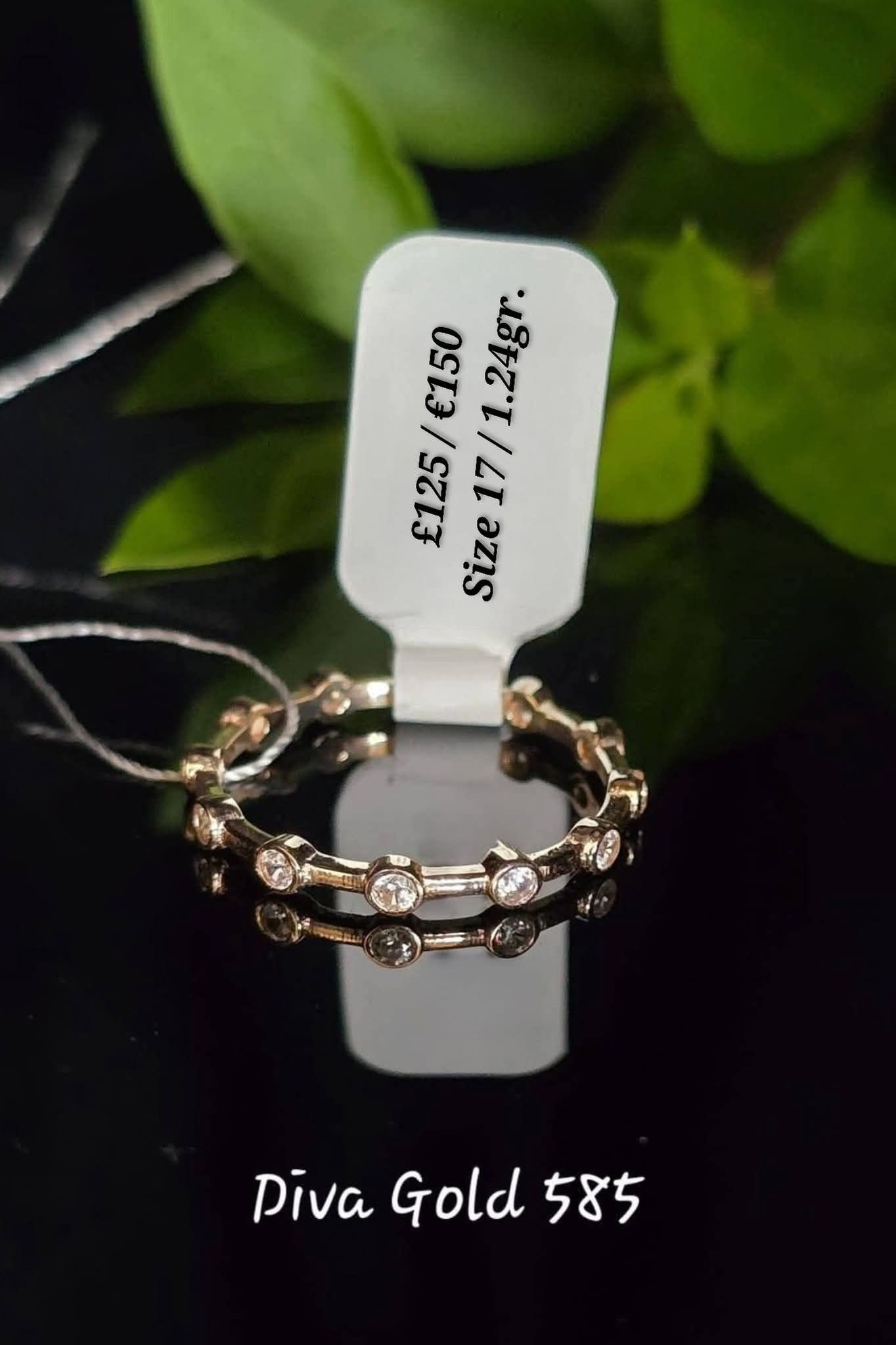 Gold ring with white zircon stones. Size 17