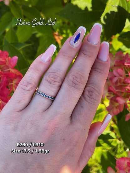 Gold women ring with blue zircon stones. Size 17.5