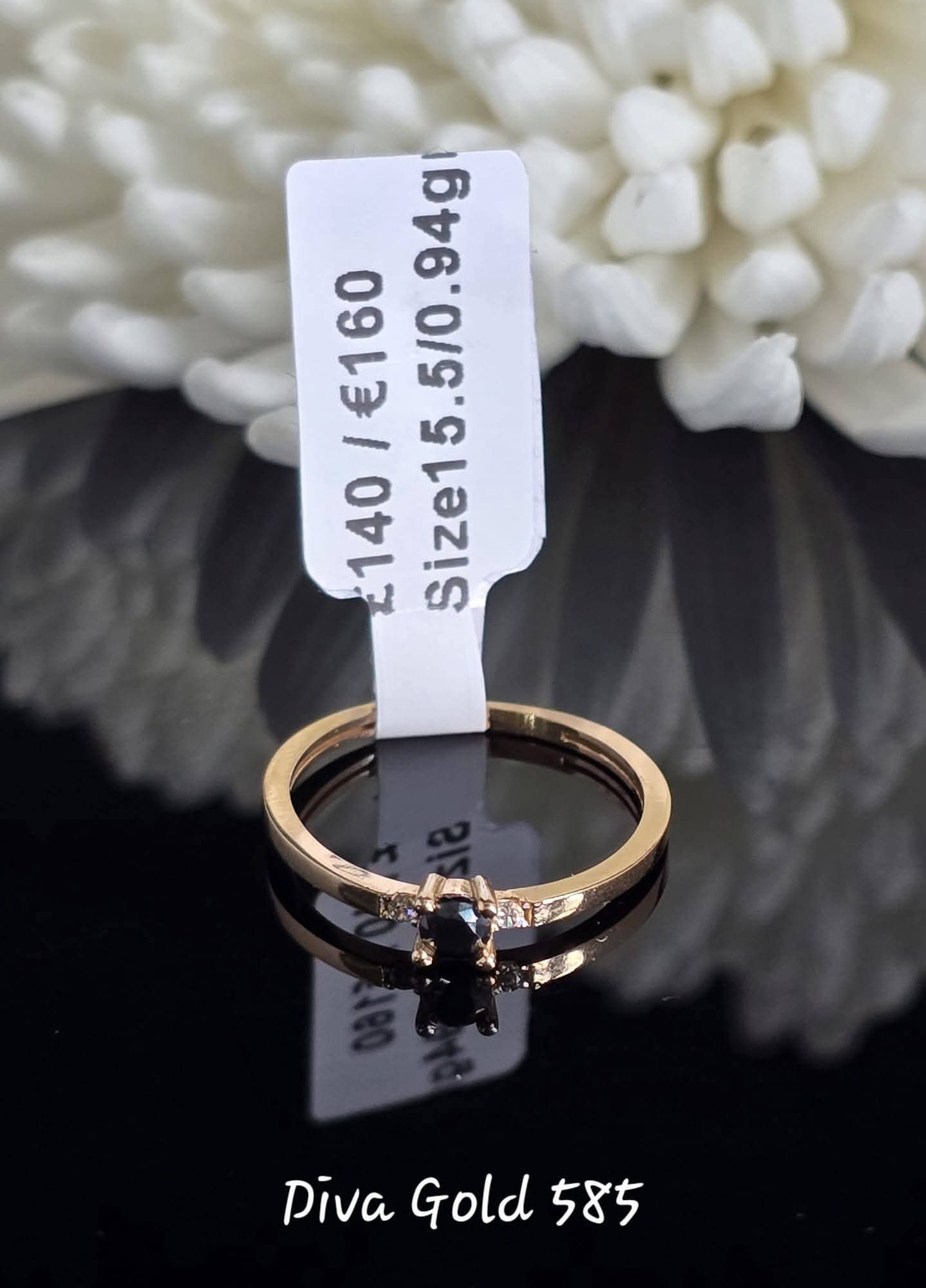 Gold women ring. Black & white zircon stones.Size 15.5