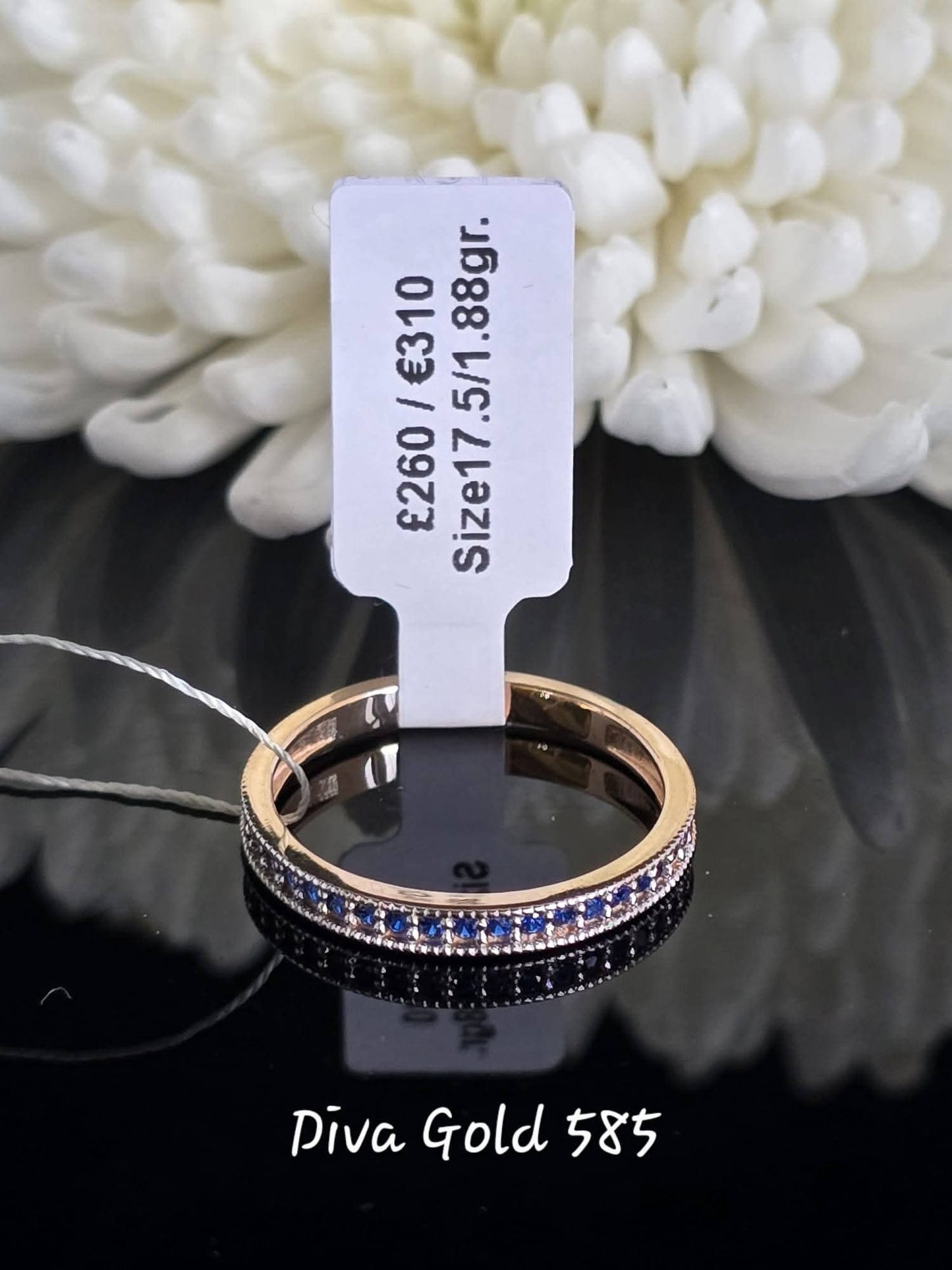 Gold women ring with blue zircon stones. Size 17.5
