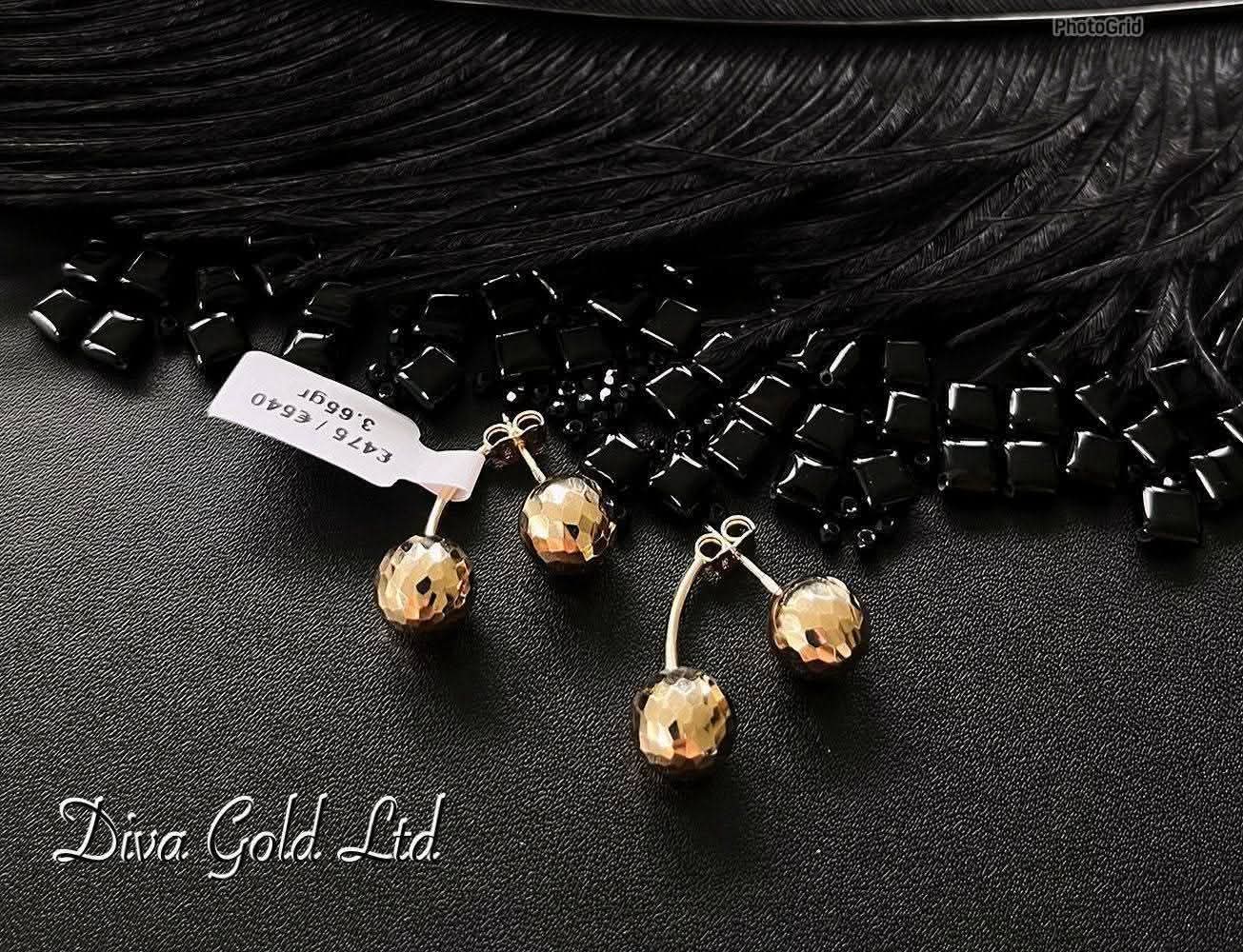 Stud gold earrings.