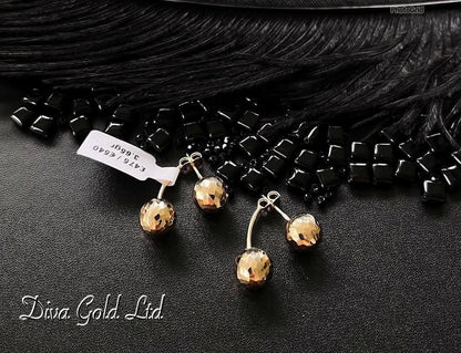 Stud gold earrings.