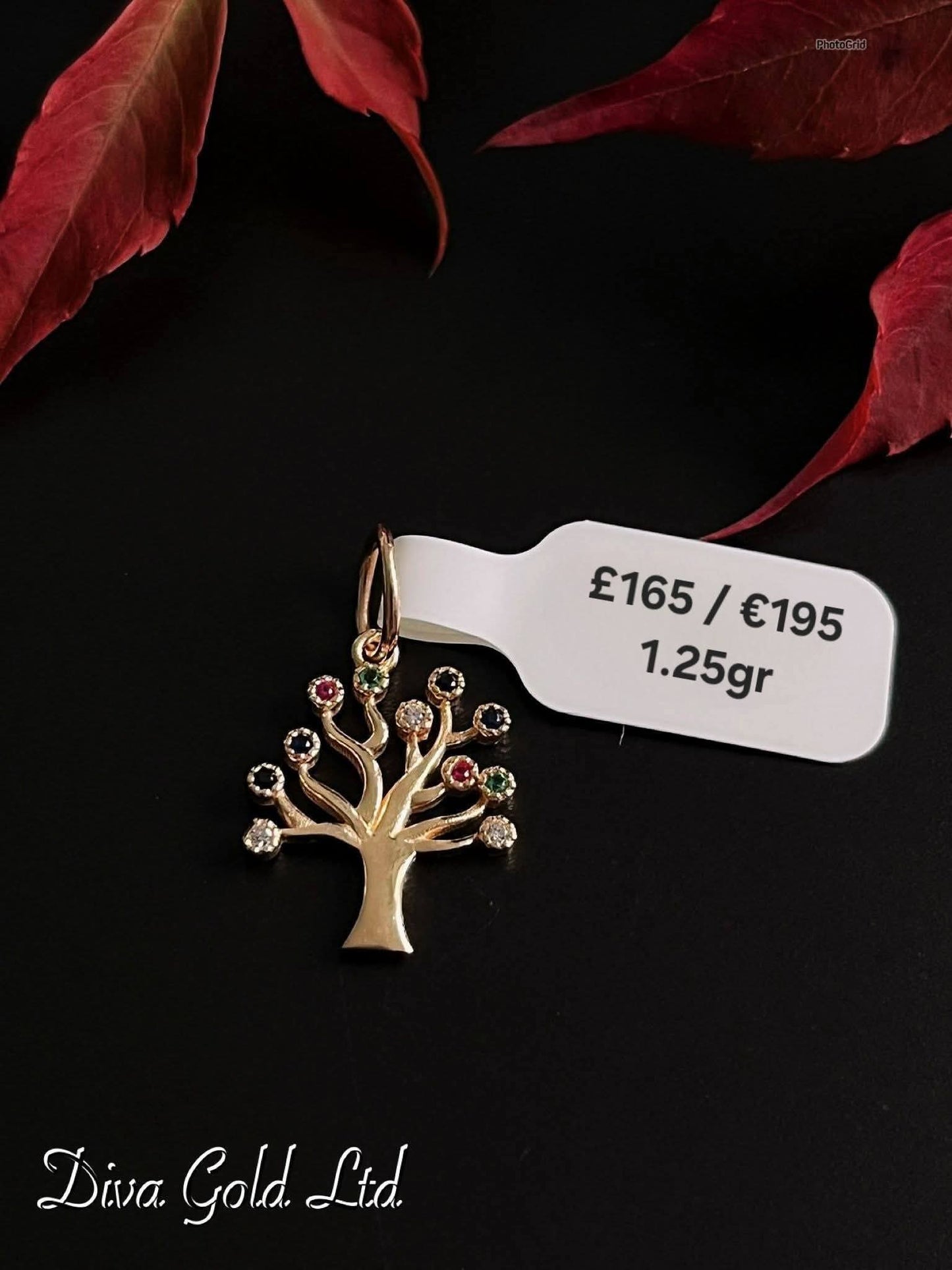 585 Gold family tree pendant. 1.25gr