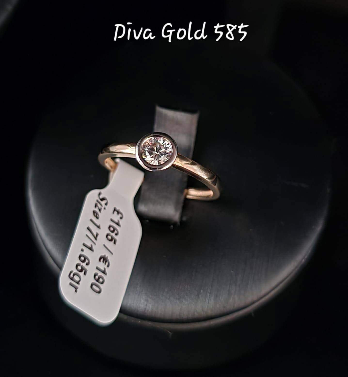 Gold ring with white zircon stones. Size 17