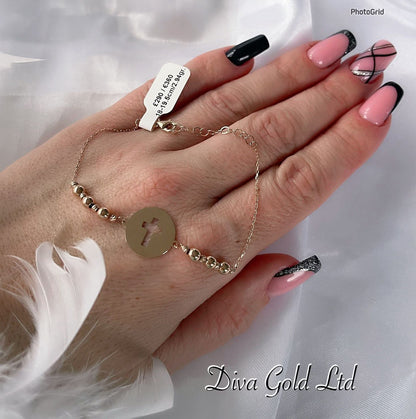 Gold bracelet with cross pendant. 18-19.5cm