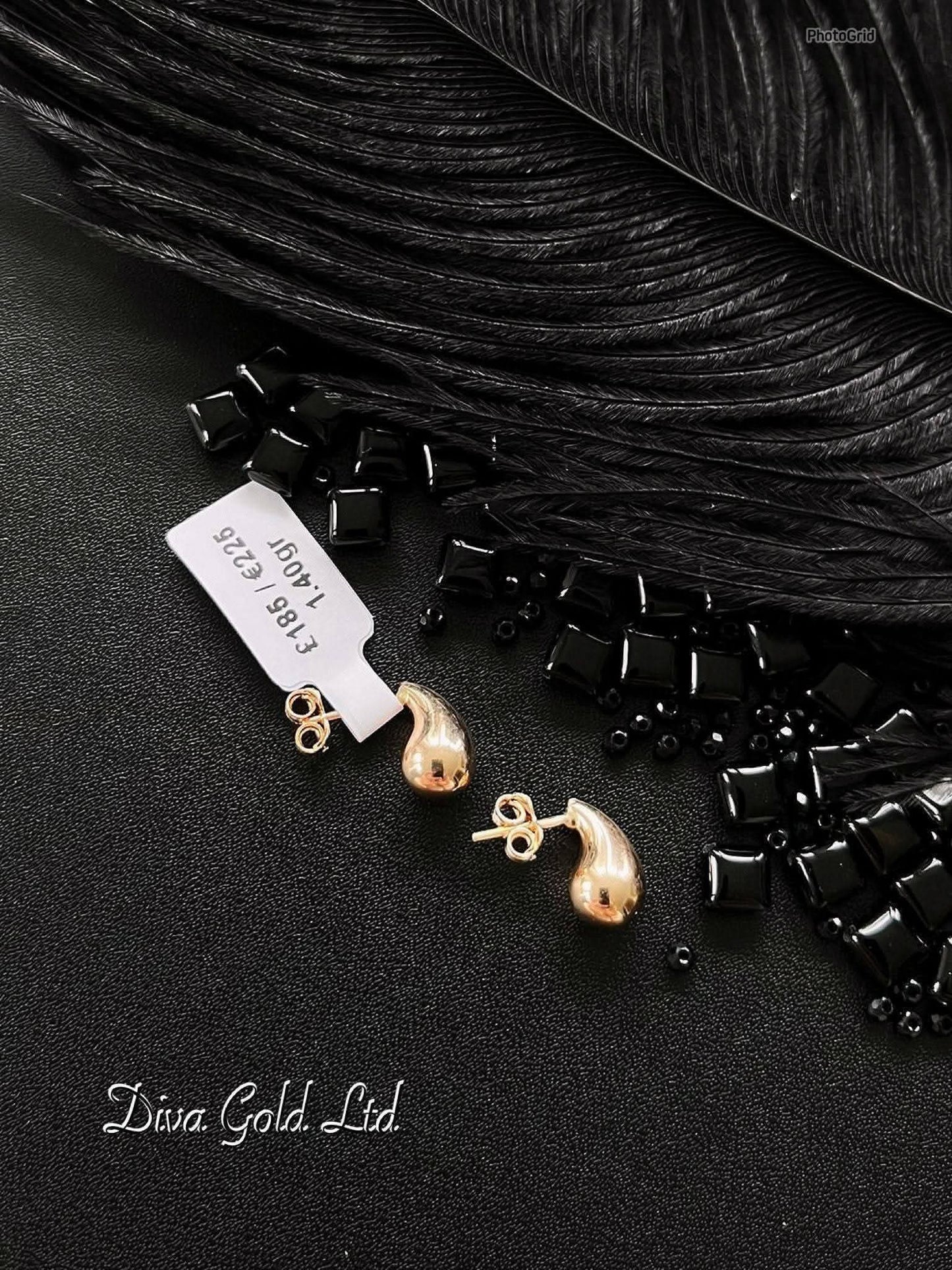 Stud drop gold earrings.