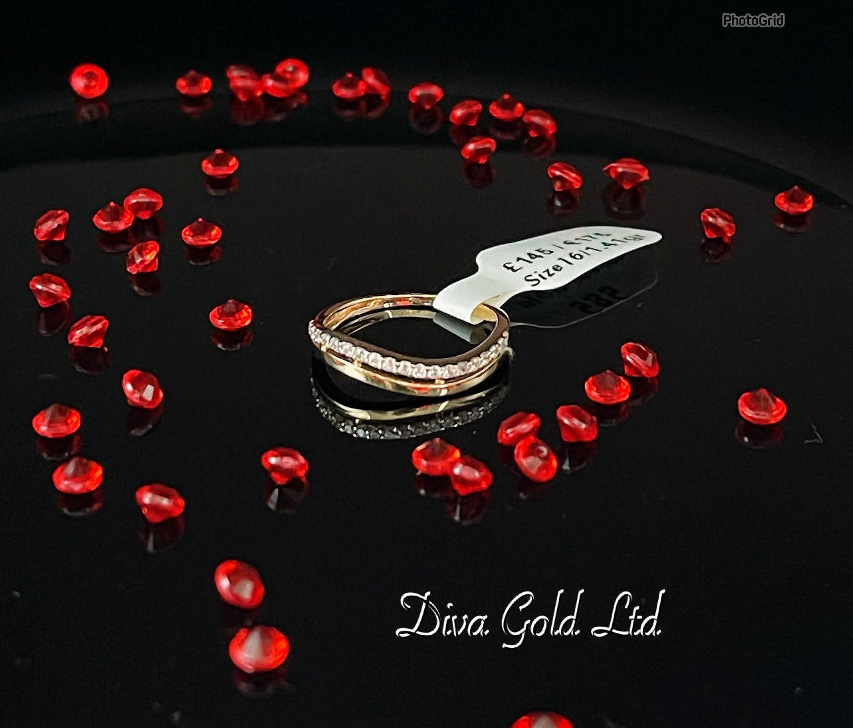 Gold ring with white zircon stones. Size 16