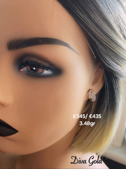 Gold 585 earrings with white zircon stones.