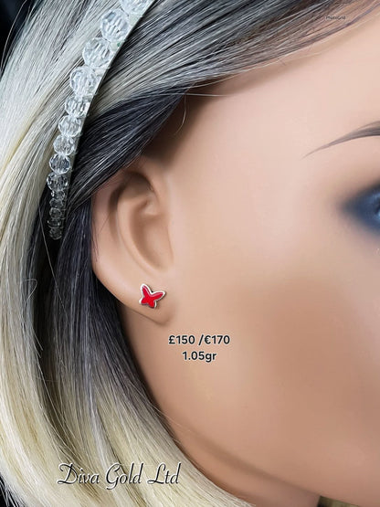 Stud gold earrings.