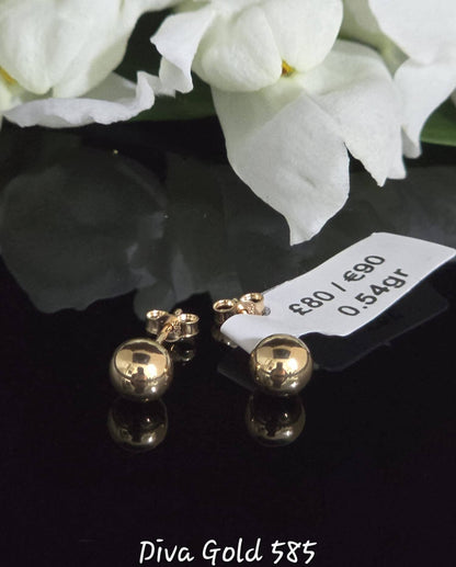 Stud gold earrings.