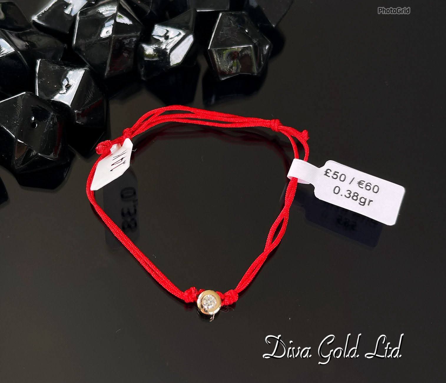 Red thread bracelet with 585 gold details. 0.38gram